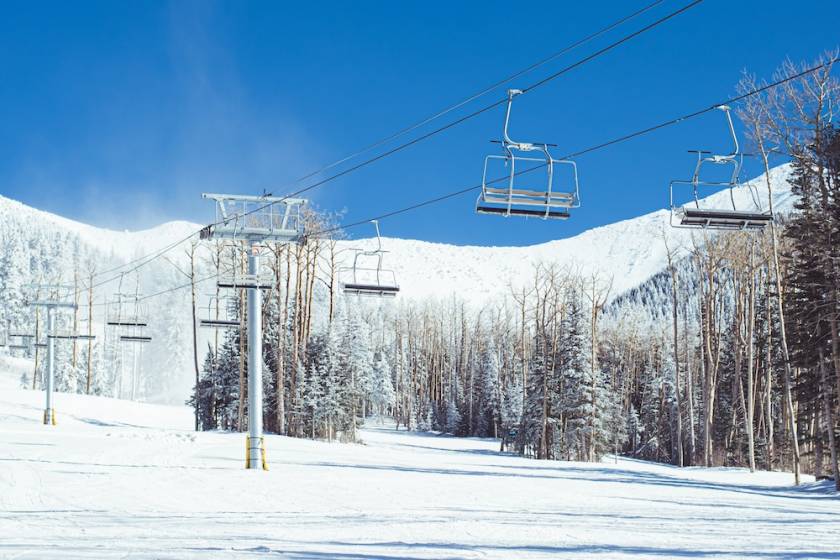 Ski lift chairs on a snowy day at Arizona Snowbowl
