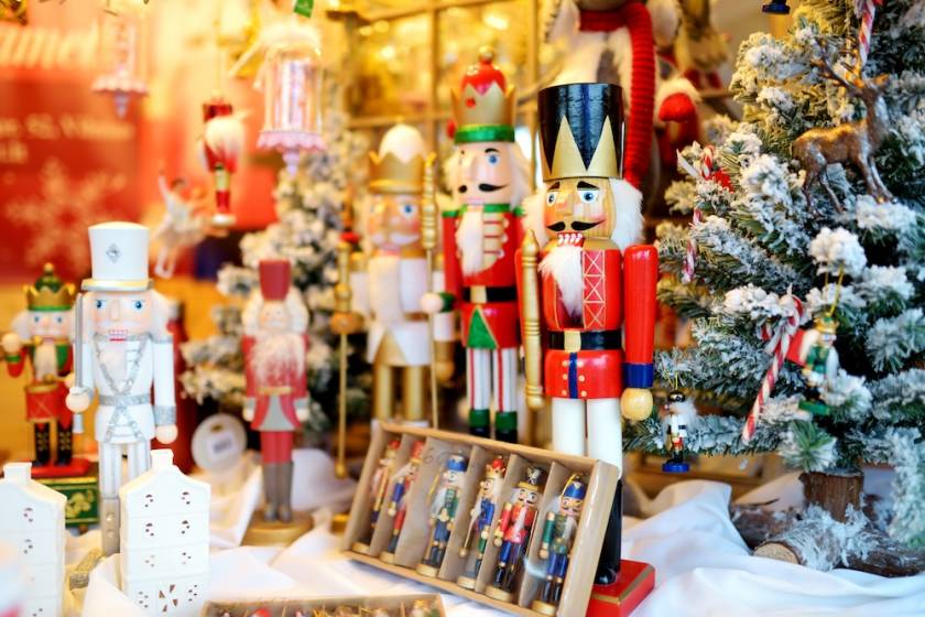 A set of wooded nutcrackers for sale at a holiday market