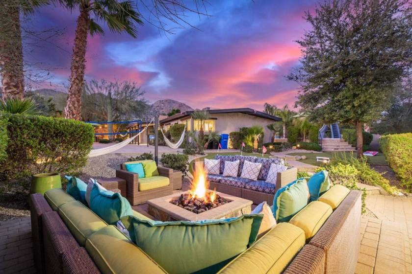 Fire pit table surrounded by patio seating