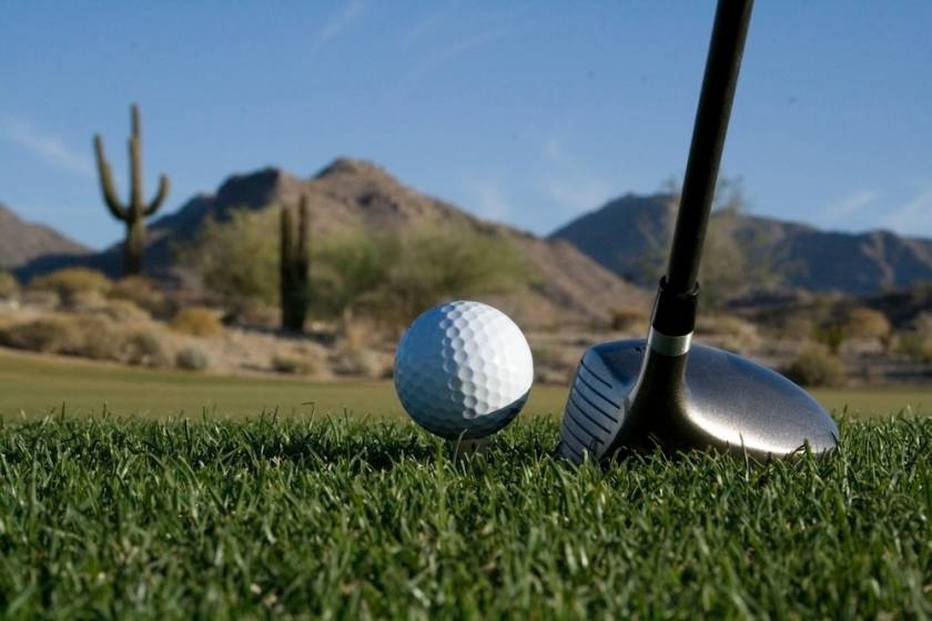 Closeup of a golf ball on a desert golf course