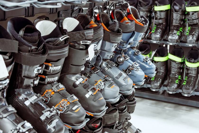 A rack containing various styles of ski boots